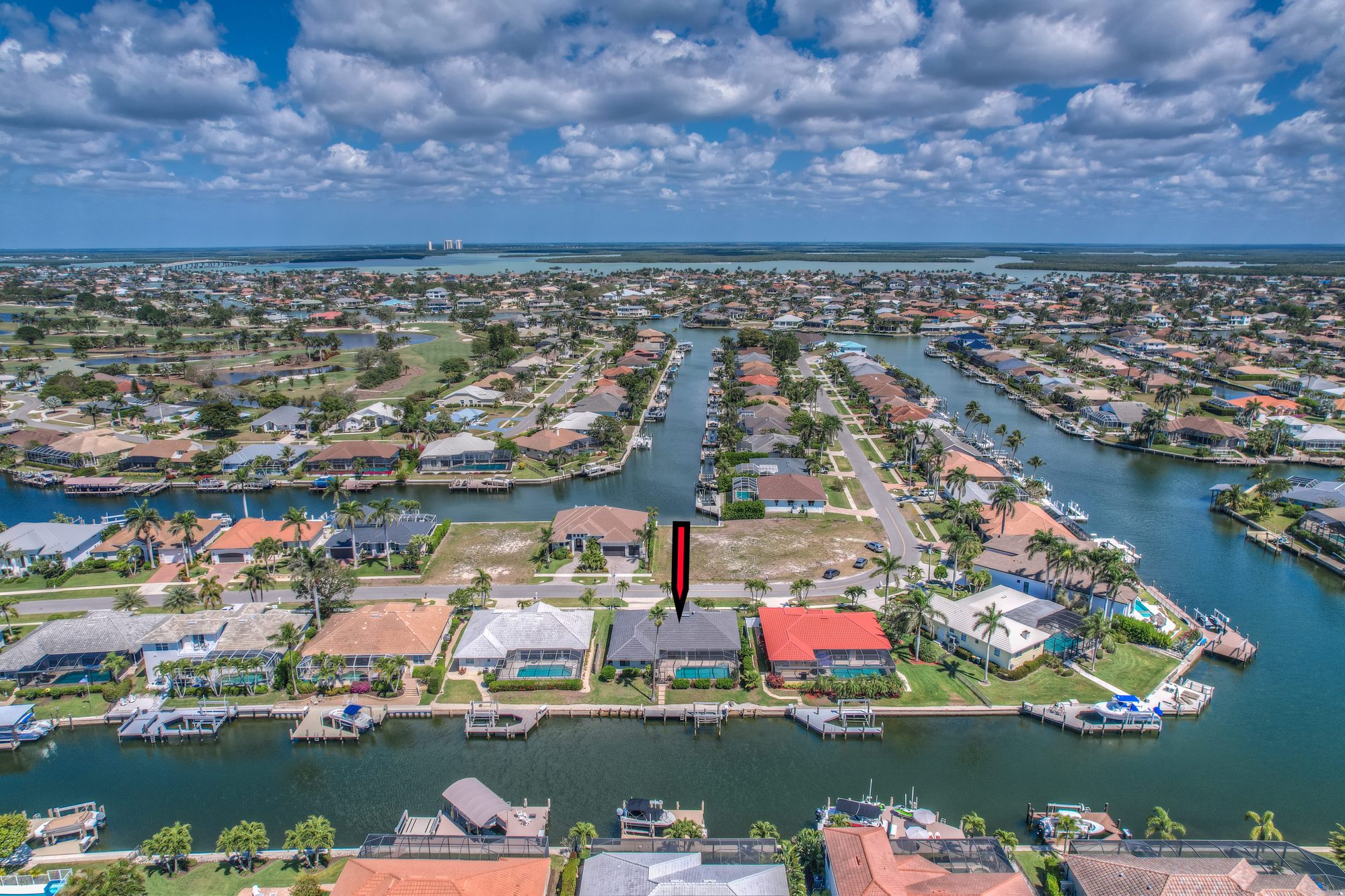Aerial drone photo of property by NaplesArchMedia