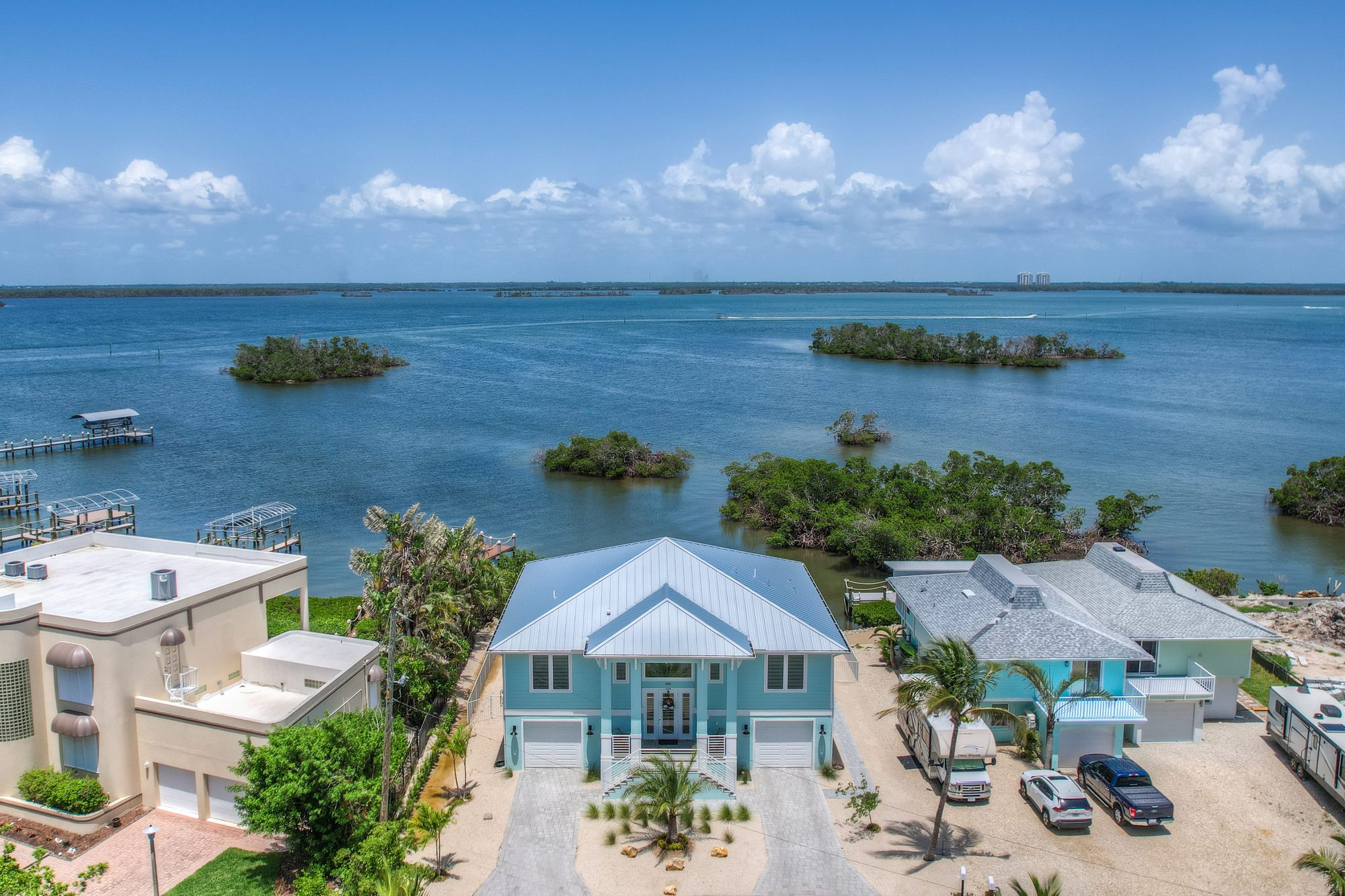Aerial drone photo of property by NaplesArchMedia